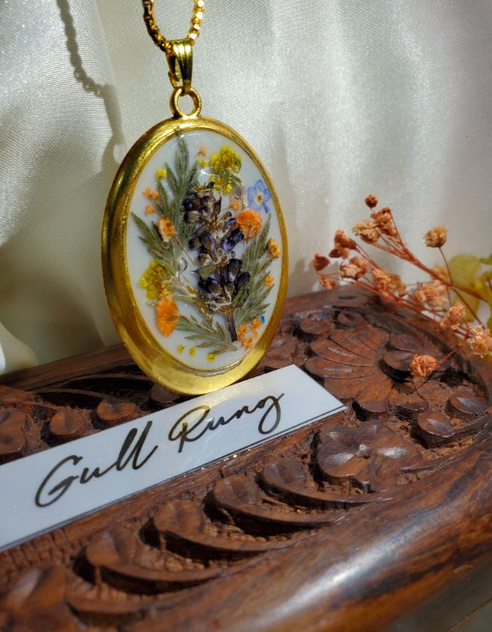 Mah-e-Bahaar white multi floral pendant, preserved flower jewelry in a gold frame