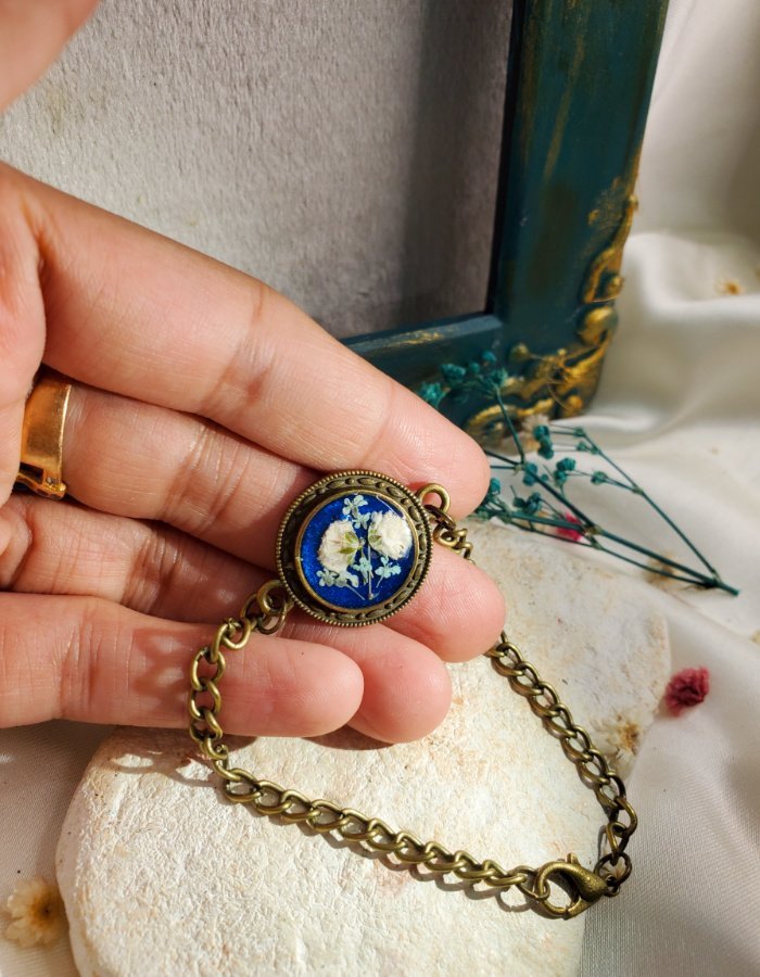 Durr‑e‑Neelam Antique Blue Floral Bracelet – handmade antique blue flower bracelet, held in hand to show size