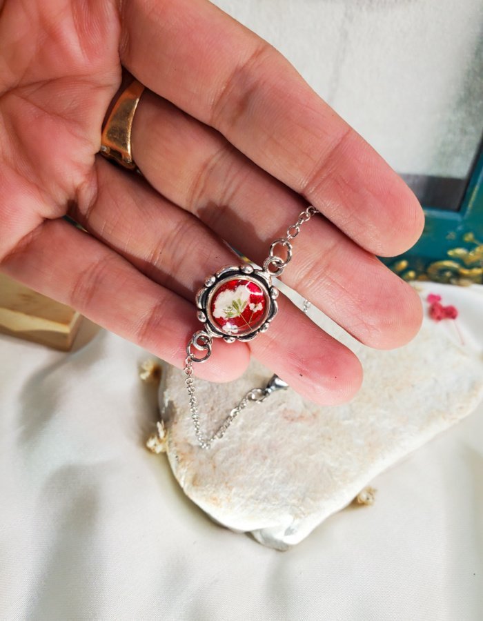 Noor‑e‑Surkh Red Floral Bracelet – handmade red flower chain bracelet, held in hand to show size